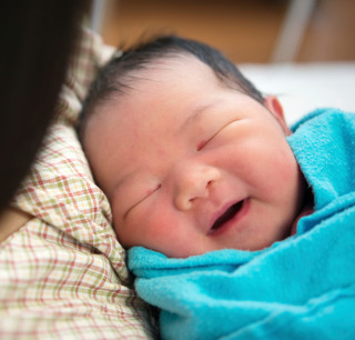 Newborn Asian baby girl and mother